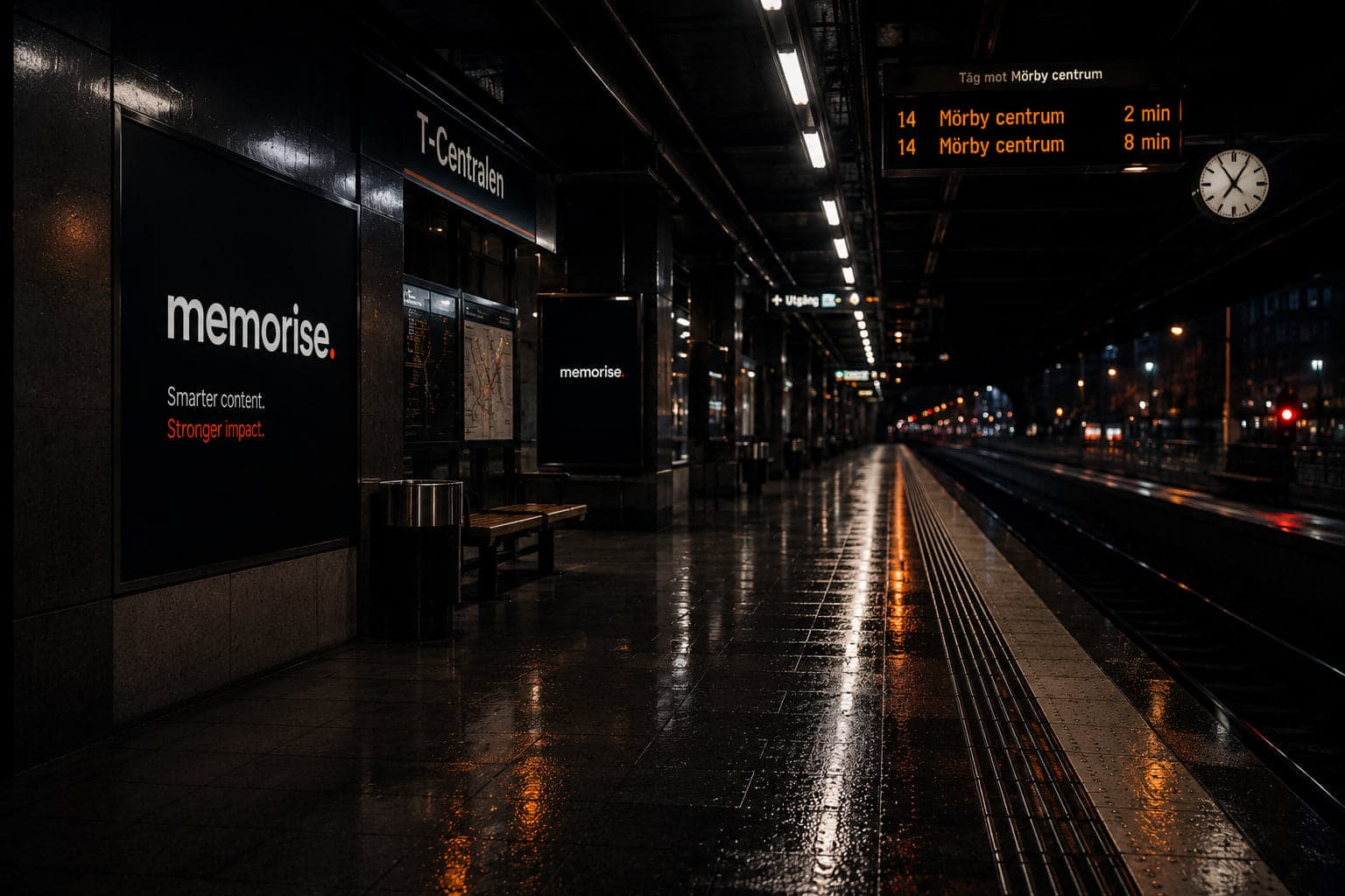 Memorise billboard in subway setting with warm lighting and wet surfaces